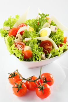 fresh and tasty salad on white background