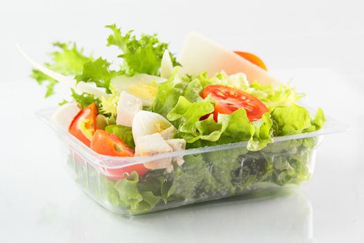 fresh and tasty salad on white background