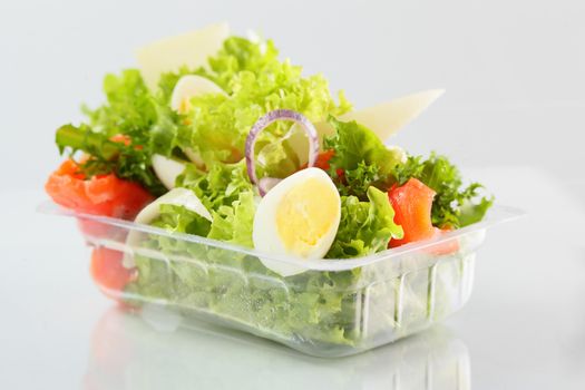 fresh and tasty salad on white background