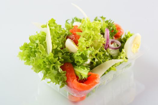 fresh and tasty salad on white background