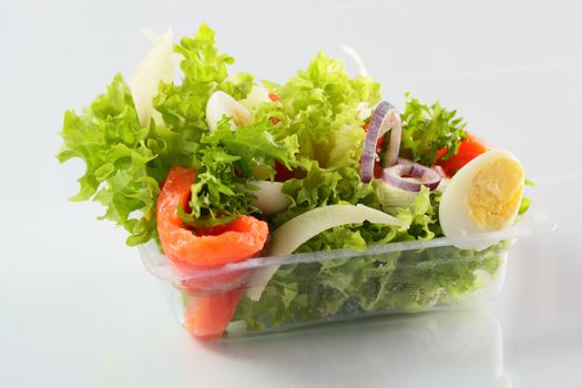 fresh and tasty salad on white background