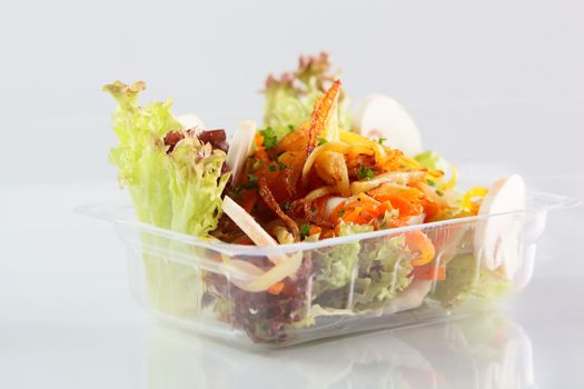 fresh and tasty salad on white background