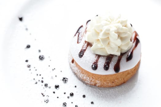 tasty and sweet cake on dish and white background