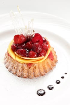 tasty and sweet cake on dish and white background