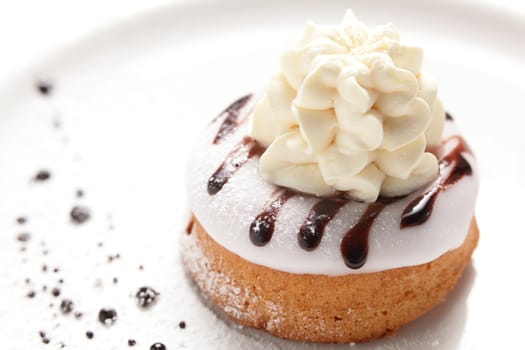 tasty and sweet cake on dish and white background