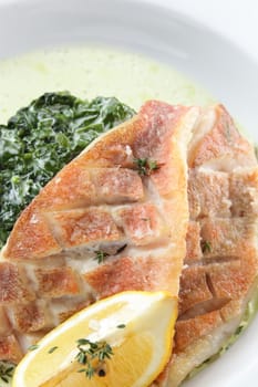 cold and fresh peaces of fish on white dish