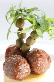 hot palm cutlets on white dish and the same background