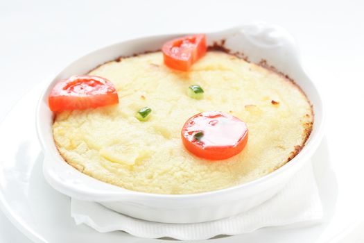 cold roasted potato with tomatoes on white dish