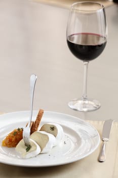 tasty peaces of cheese on white dish with garnish