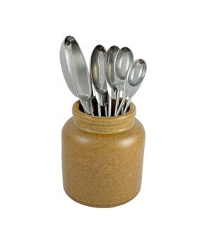 Brown ceramic jar holding metal measuring spoons, isolated on a white background 