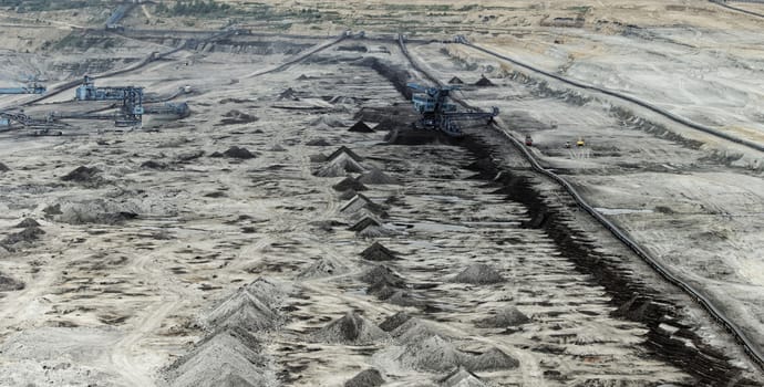 Coal mining in an open pit with huge industrial machine