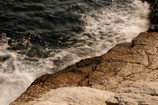 the rocky beach breaks the huge waves