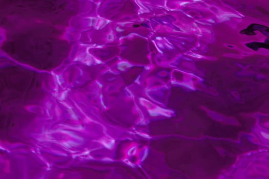 purple abstract background of wavy water surface (lilac)