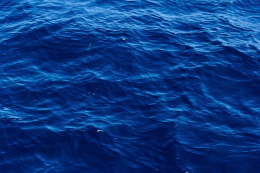 blue abstract background of wavy water surface