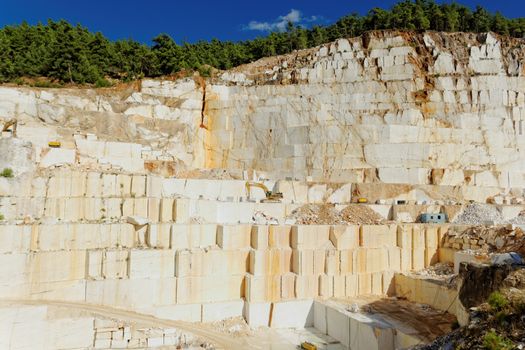 Detail of huge Thassos white marble quarry (mine) with grabber