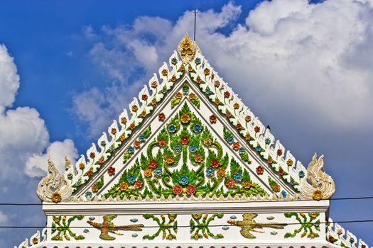The gable roof of the ordination hall in thai buddhist temple