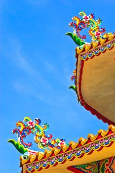 The design of the overlapping flowers and decorated on the roof of chinese temple