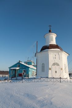 wooden building of the airport and chapel on the Solovki in the winter
