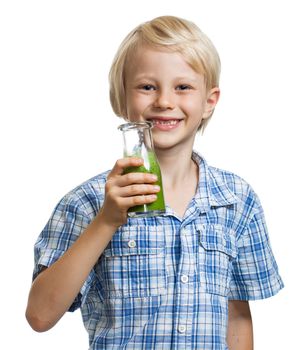 Happy cute boy with a bottle of green smoothie or juice. Isolated on white.
