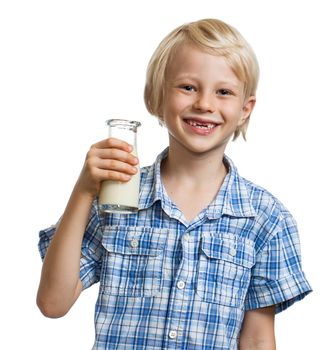 Laughing cute boy with a milk moustache holding a bottle of milk. Isolated on white.