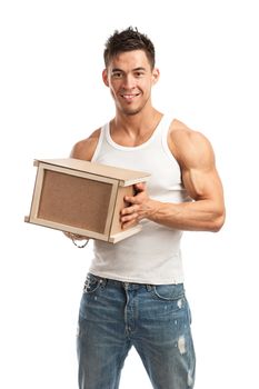 Muscular young man holding parcel over white background