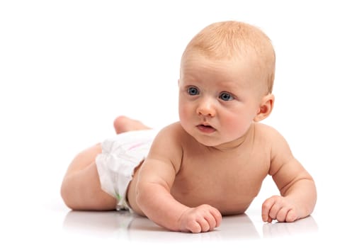 Cute baby boy lying on stomach over white background