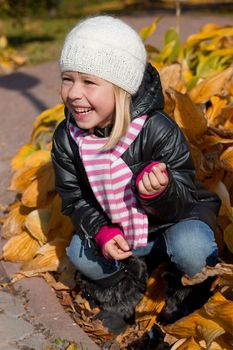 Cute girl in autumn park portrait