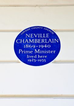 Blue plaque marking the former residence of Neville Chamberlain - a former Prime Minister.