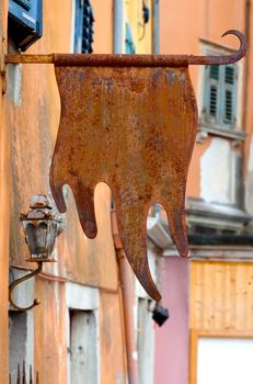 old rusty sign on the background of the house