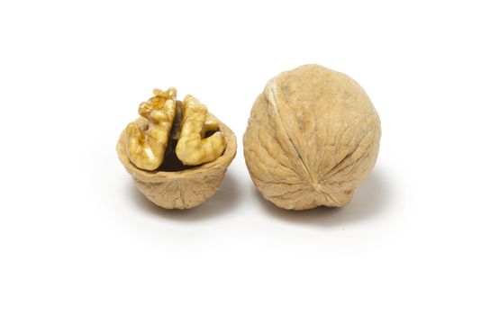 Close-up of two walnuts on white background