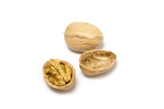 Close-up of two walnuts on white background