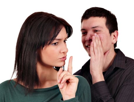 boyfriend whispers a secret to girlfriend