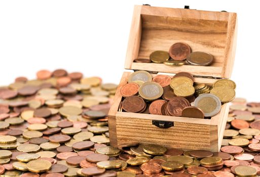 A treasure chest with a bunch of Euro coins and cents