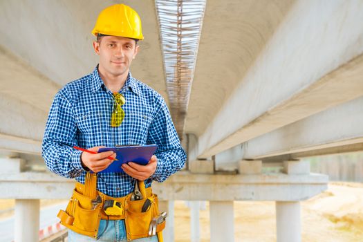 a contractor under the bridge under construction