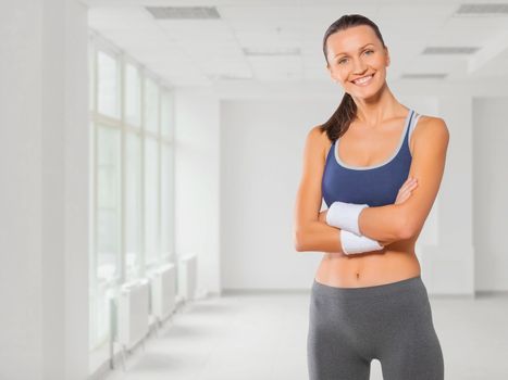 beautiful fitness girl smiling arms crossed