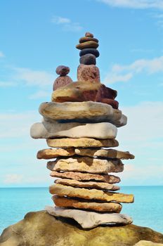 Stack of pebbles on the sea boulder