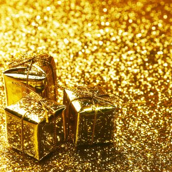 Christmas gift boxes on shiny background close-up