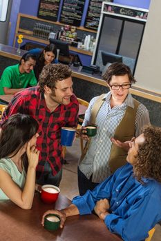 Mixed group of people in a coffee house