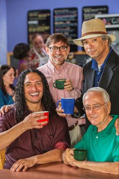 Diverse group of handsome men in coffee house