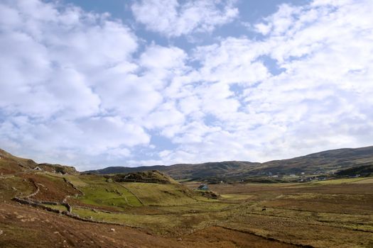 sheep grazing on the hills of Malainn Mhoir in Gleann Colm Cille, county Donegal Ireland