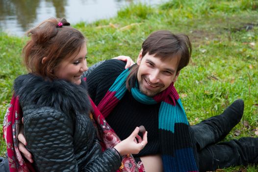 a man and a woman embracing the nature autumn