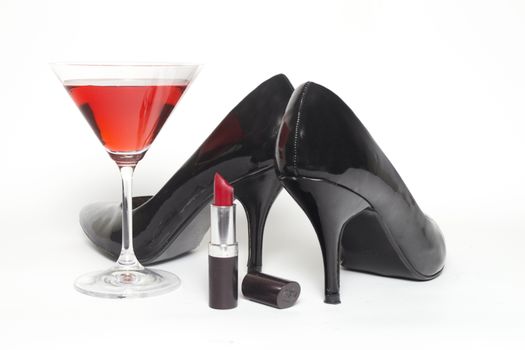 Girls night out concept with shoes, drink and lipstick