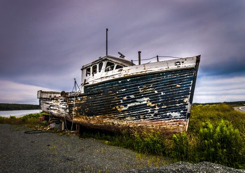 abandonned rusty boat located on a panoramic route to Halifax Nova Scotia Canada