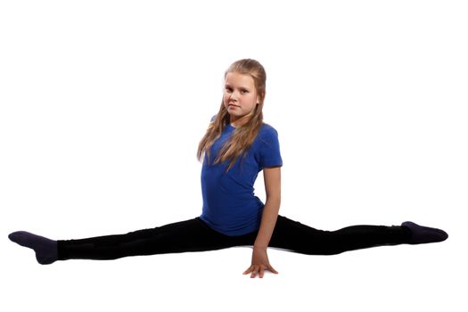 young gymnast doing splits on white background