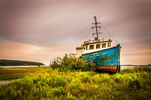 abandonned rusty boat located on a panoramic route to Halifax Nova Scotia Canada