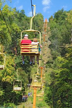GATLINBURG, TENNESSEE - OCTOBER 6: Tourists ride the Sky Lift in Gatlinburg, Tennessee, October 6, 2013. Gatlinburg is a major tourist destination and gateway to Great Smoky Mountains National Park.