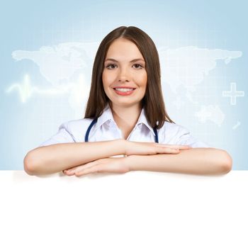 Young attractive female doctor put her hands on the blank banner, place for text