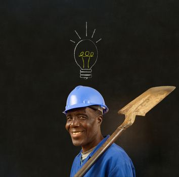 African American black man worker with chalk lightbulb on a blackboard background