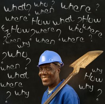 African American black man worker with chalk questions on a blackboard background