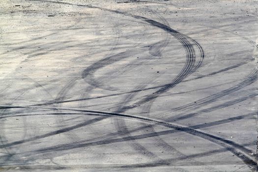 Background with tire marks on road track